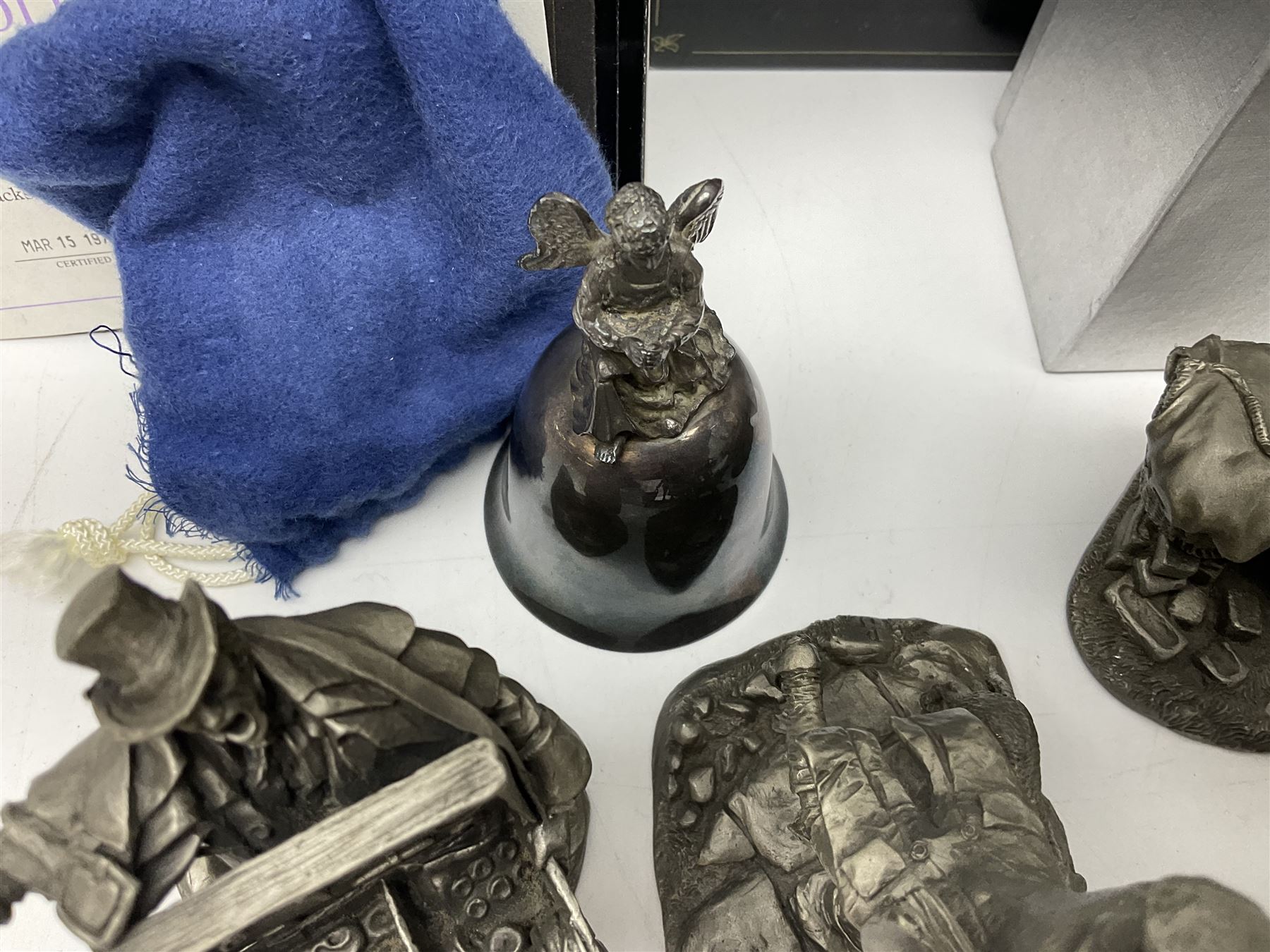 Twelve Franklin Mint pewter figures, to include some from the Cries of London series, together with a Franklin Mint 1937 Rolls Royce Phantom III pewter model and Danbury Mint Christmas bells