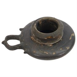 Etruscan terracotta oil lamp, with black glaze, flat loop handle and laurel leaf border, the opening with later turned wooden collar, signed to base 'repaired by one James Naysmith 1887', H7cm 