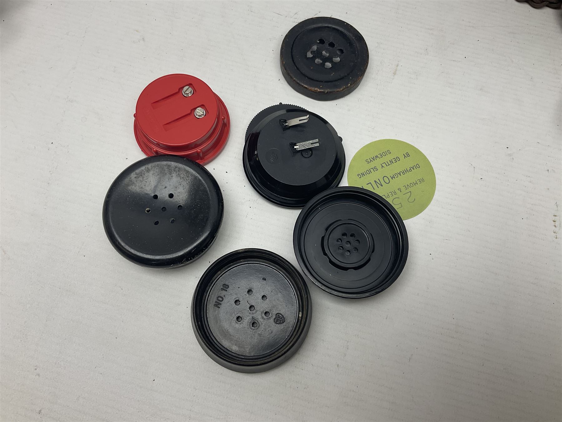 Collection of phone headsets, including GPO bakelite examples, together with other telephone parts 