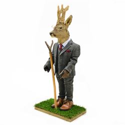 Anthropomorphic Taxidermy: Roe Deer (Capreolus capreolus), in a standing pose dressed as a gentleman with suit and waistcoat, leather shoes and horn handled thumbstick, H112cm