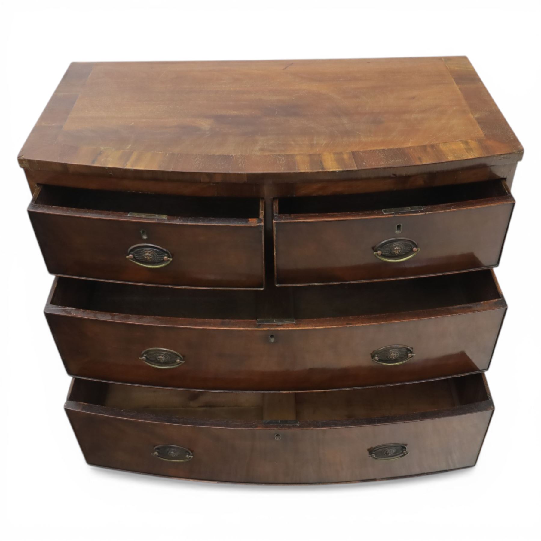 19th century small bow fronted mahogany chest, fitted with two short and two long drawers, raised on shaped bracket feet