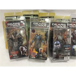 Sixteen carded action figures comprising seven 'Gears of War'; four 'Hitchhikers Guide to the Galaxy'; two 'Torchwood'; 'Planet of the Apes'; 'Bruce Lee'; and 'Assassin's Creed'; all in unopened packs (16)
