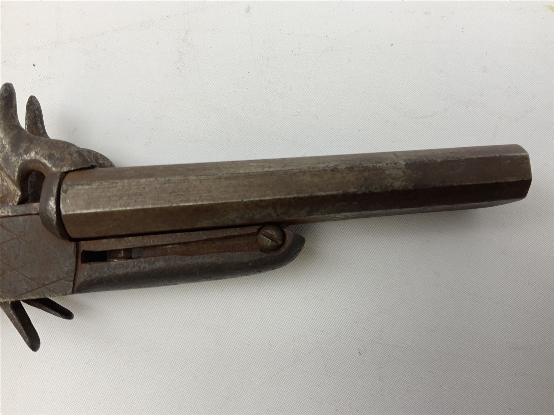 19th century Belgian 9mm side-by-side double barrel pin-fire pocket pistol with 11cm octagonal single block barrel, drop-down triggers and carved walnut stock L22.5cm overall