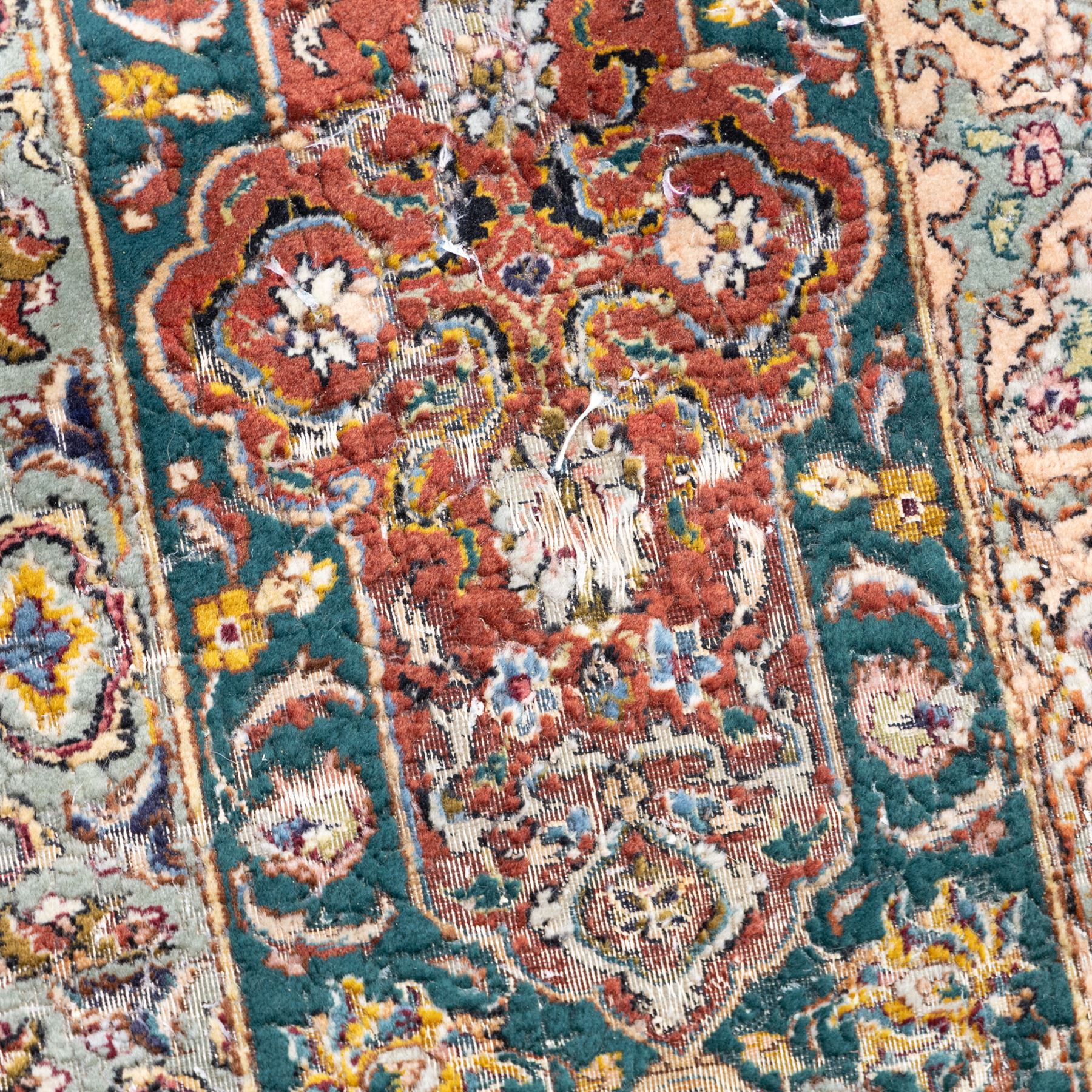 Persian Tabriz type carpet, the teal ground decorated with central medallion, radiating palmettes and dense floral scrollwork, within multiple floral borders