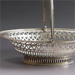 George III silver bon bon basket, of oval form with bead rim and swing handle, the sides with pierced latticework decoration, hallmarked Hester Bateman, London 1785, handle H14cm