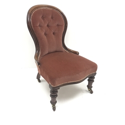  Victorian mahogany framed spoon back nursing chair, upholstered in deep buttoned fabric, turned supports, W57cm  