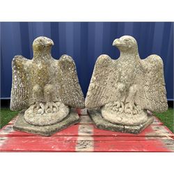 Pair composite stone perched eagle figures/gate post toppers with spread wings, on hexagonal slab base - THIS LOT IS TO BE COLLECTED BY APPOINTMENT FROM DUGGLEBY STORAGE, GREAT HILL, EASTFIELD, SCARBOROUGH, YO11 3TX