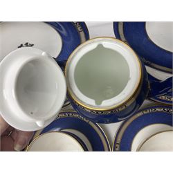 Wedgwood part tea and coffee service, comprising coffee pot, six coffee cans with five saucers, seven teacups with ten saucers and seven side plates, each decorated with floral bouquet to centre, in a gilt and speckled blue border, pattern x9933, with printed mark beneath