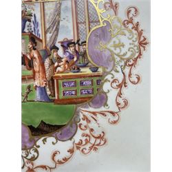 Large and impressive 18th century Meissen dish, finely painted with a chinoiserie scene to a central shaped reserve, depicting figures and attendants engaged in various pursuits, the reserve with gilt scrollwork edge, filled with Böttger lustre and detailed with iron red scrollwork, surrounded by flower heads, the rim with four quatrofoil Kauffahrtei scene panels of merchants and figures by a quayside in purple monochrome, with gilt scroll border, with under glazed blue crossed swords mark, and gilt gilders mark, D39cm
