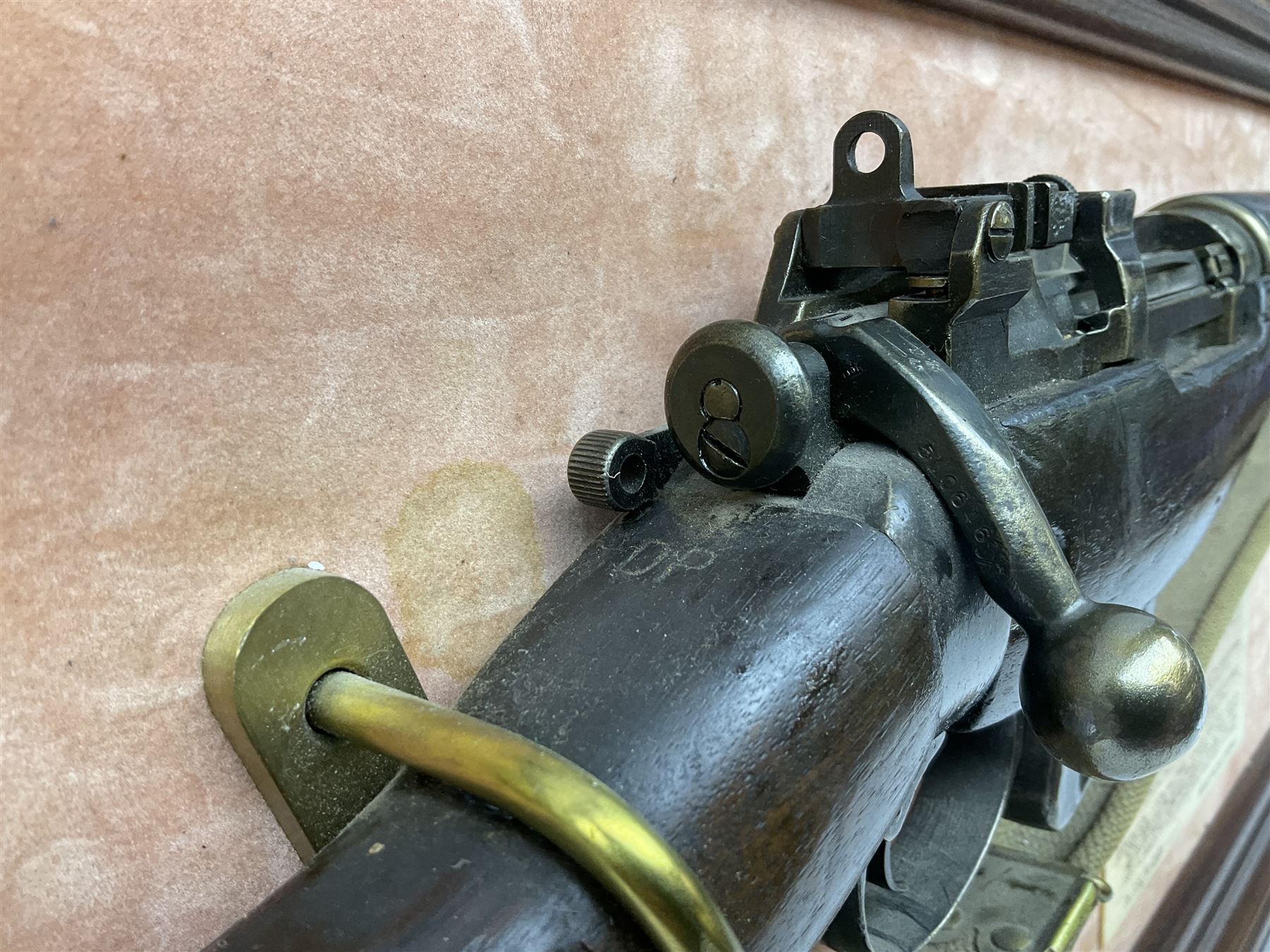 WW2 Lee Enfield No.4 Mk.1 .303 bolt-action rifle with hinged butt compartment, made by SA Ltd., Long Branch, Canada 1942, serial no.5L0646 L113cm; mounted on a framed display board with No.4 Mk.II spike bayonet, No.9 Mk.1 blade bayonet, two inert 5-round clips and brass biographical plaque by Antler Military Originals detailing DA Cert No.C3444 OLD STYLE DEACTIVATION SO FIREARMS CERTIFICATE REQUIRED OR RFD