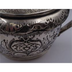 George III silver teapot, of oval form, with embossed foliate, floral and scroll decoration and engraved central cartouche, with acanthus capped C handle with ivory insulators, hallmarked John Emes, London 1807 This item has been registered for sale under Section 10 of the APHA Ivory Act
