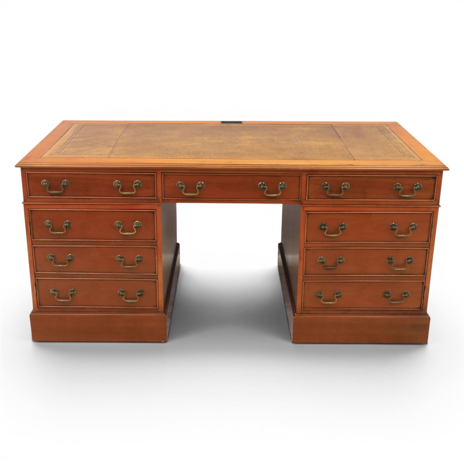 Georgian design yew wood twin pedestal office desk, the top featuring an inset leather writing surface, with drawer drawers and centre keyboard slide, all above two cupboards with slide out shelves