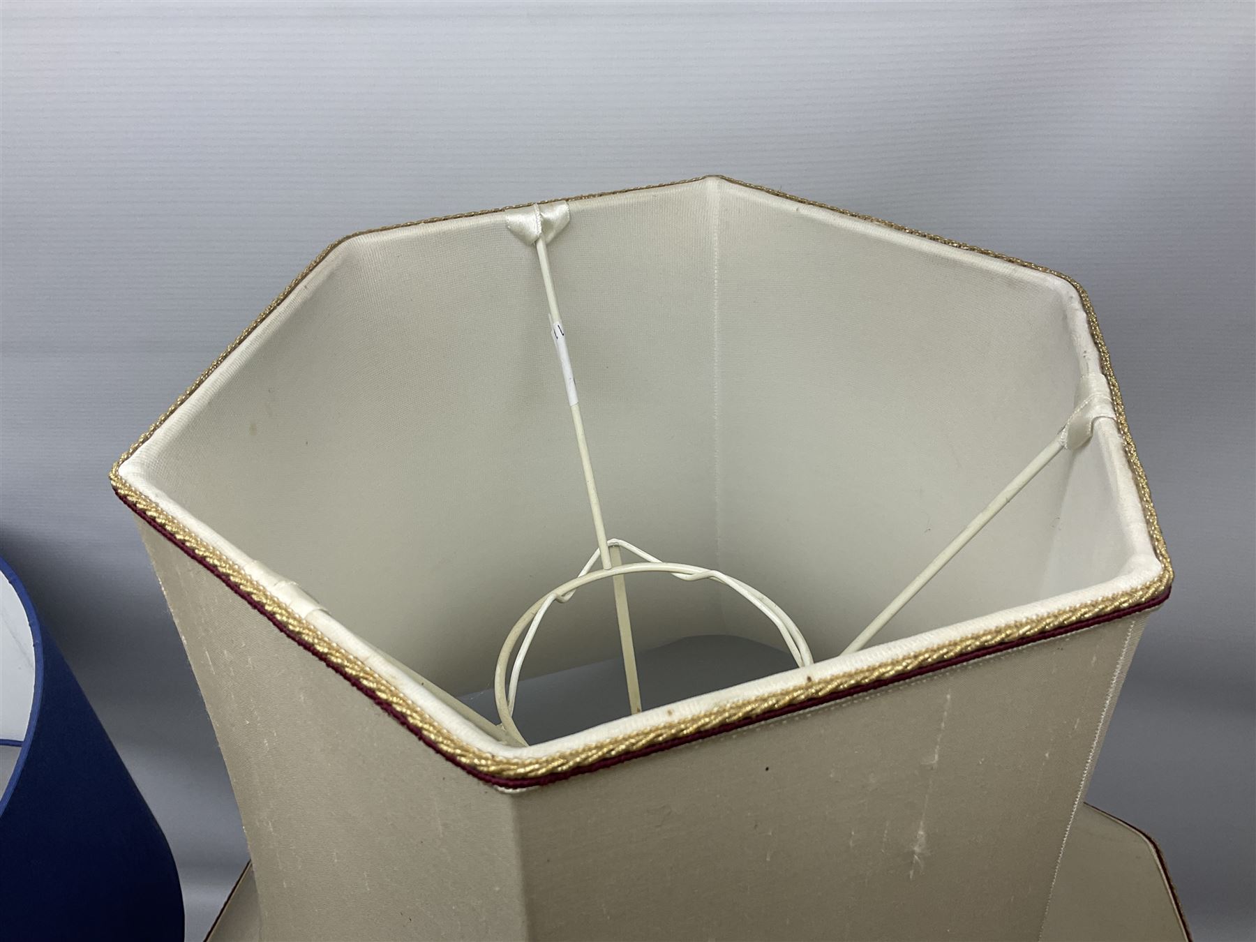 Modern pierced oriental white ceramic vase shaped table lamp, together with a blue and white baluster shaped example decorated with figures upon elephants, both with shades, tallest H83cm incl shade