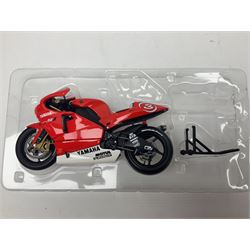 Four Minichamps 1:12 scale die-cast motorcycles - Honda RC211V Team Movistar Honda MotoGP Rider Marco Melandri MotoGP 2005; Yamaha YZR-M1 Antena 3 Yamaha D'Antin Shinya Nakano MotoGP 2003; Yamaha YZR-M1 Max Biaggi MotoGP 2002; and Ducatti 999FO4 Gregorio Lavilla BSB 2005; all boxed (4)