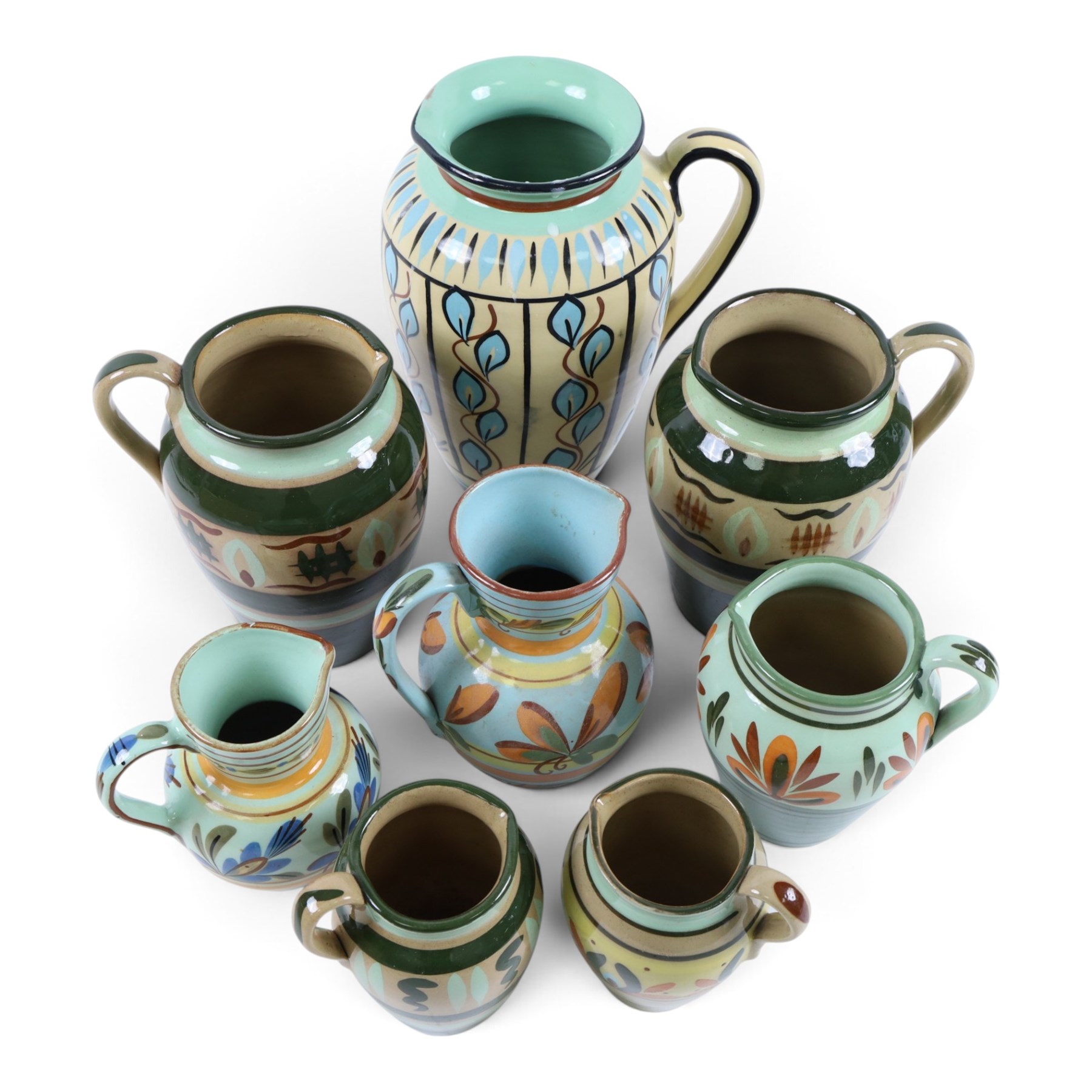 Eight Hartrox and Dee Cee Stoneware jugs, all with floral and abrstact decoration, with printed marks beneath, tallest H24cm