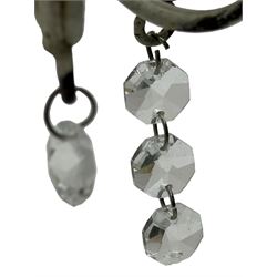 India Jane Interiors - six branch metal chandelier, the scrolled crown over circular bulbous body with six projecting branches, decorated with scroll work and glass pendants, in distressed white paint finish - ex-display/bankruptcy stock 