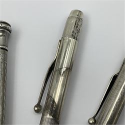Six silver propelling pencils/pens, including Fyne Point and Longerlead examples, all stamped or hallmarked, together with an Ever Point gold filled example