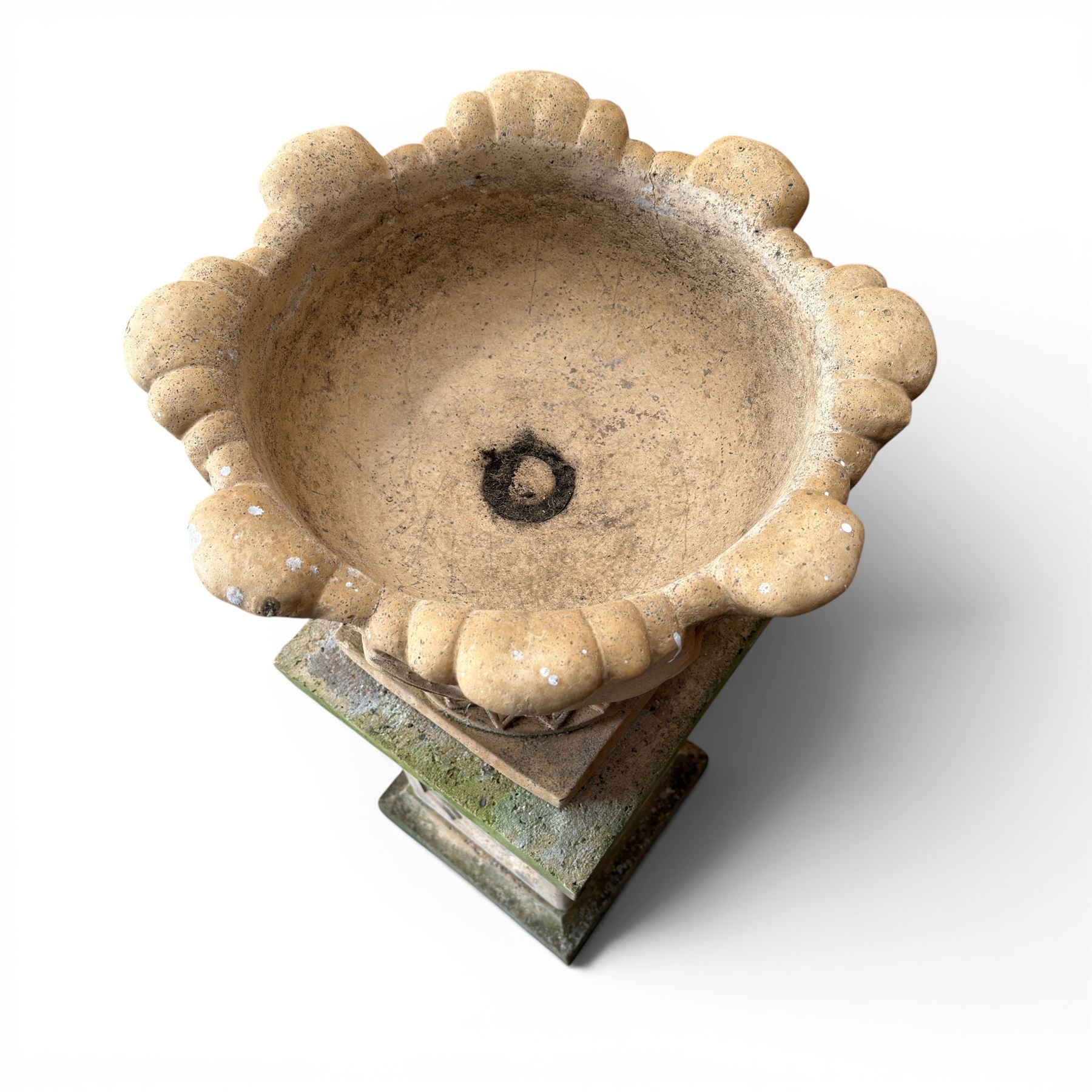 Cast stone five sectional urn on plinth, squat leaf and petal design urn on square base