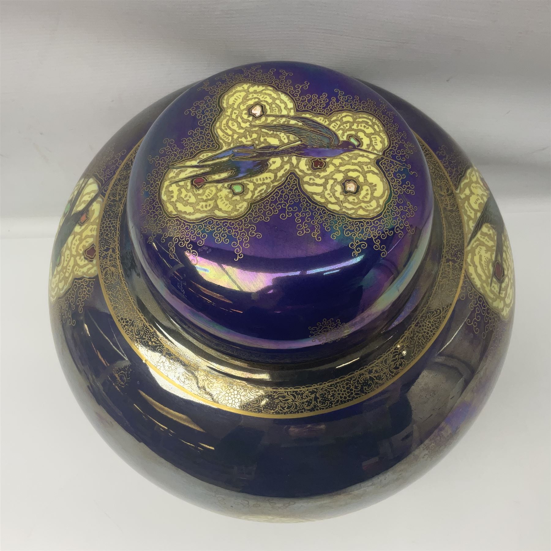 Carlton Ware lustre ginger jar and cover decorated with birds in flight on a blue ground, H32cm