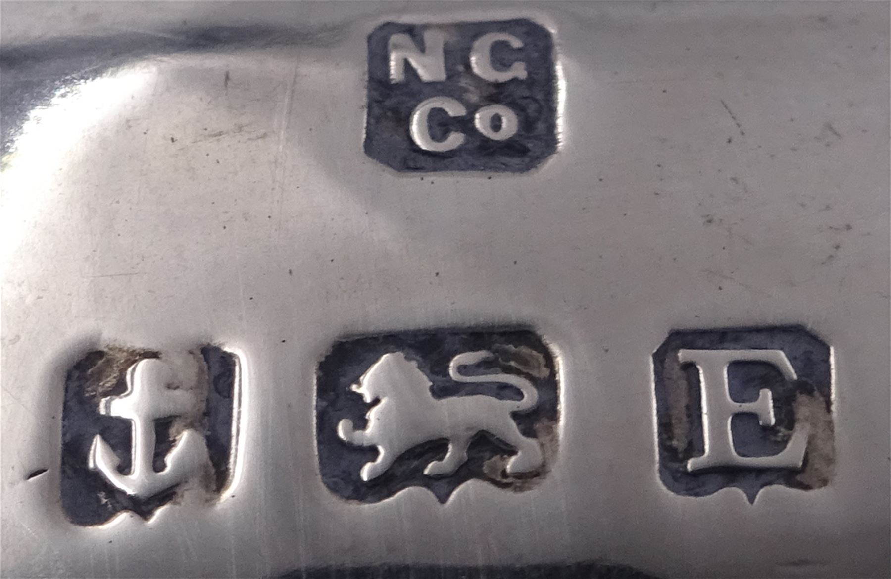 1920s silver teapot, of oval faceted form, with Bakelite type handle and finial, with presentation engraving to body, and upon four paw feet, hallmarked Northern Goldsmiths Co, Birmingham 1929, H16cm