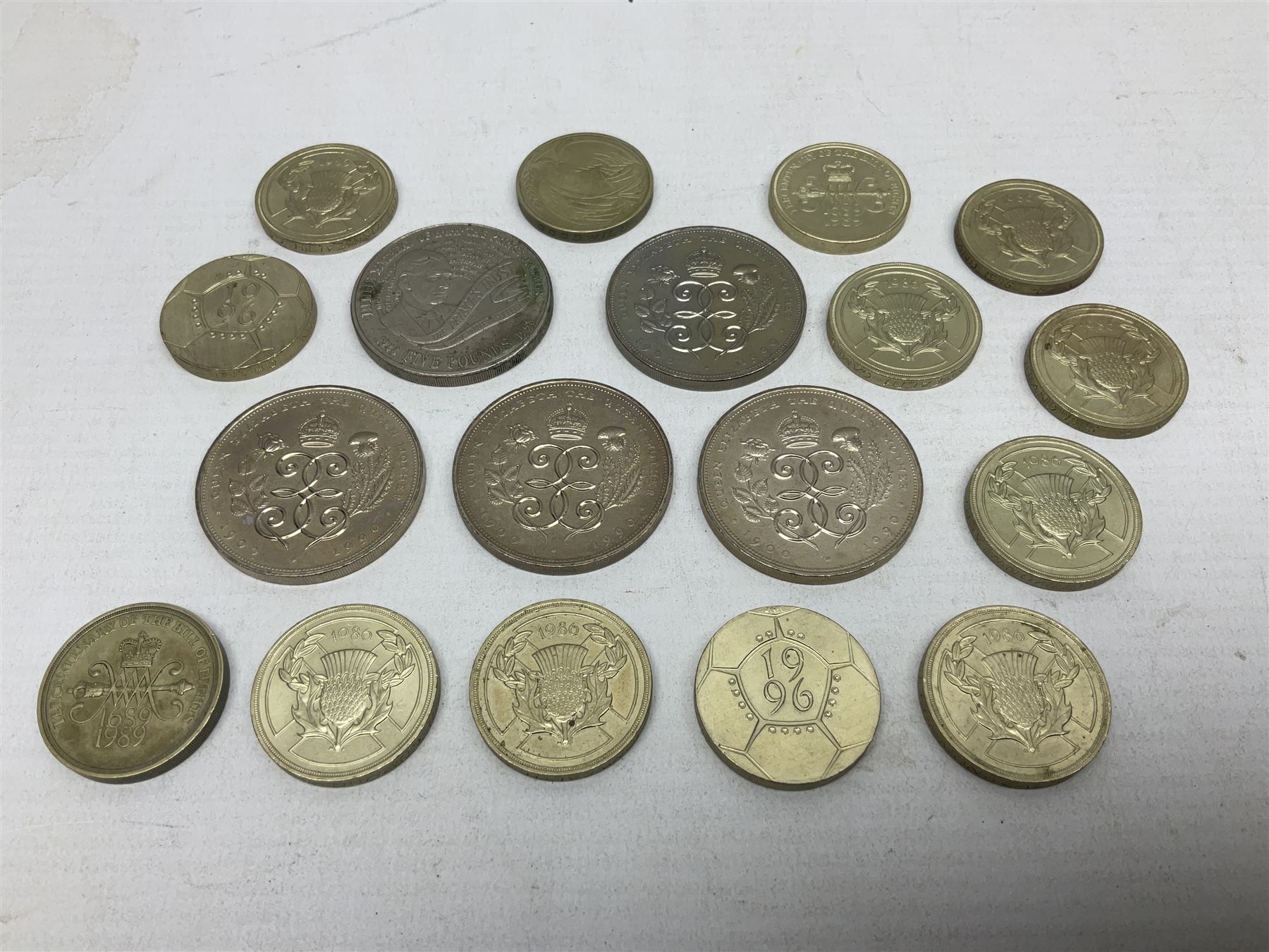 Five Queen Elizabeth II five pound coins and thirteen old style two pound coin