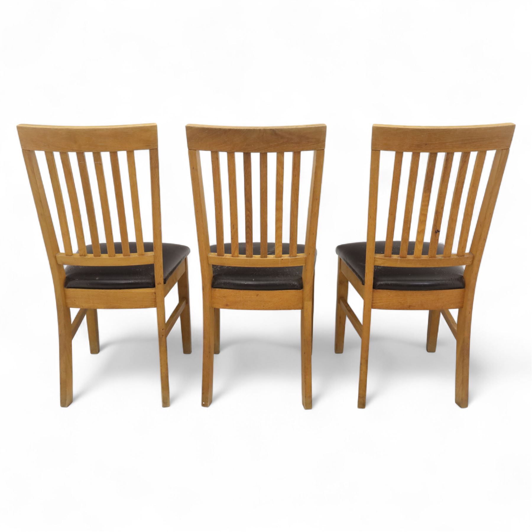 Contemporary set of six light oak dining chairs with faux leather cushion seats 