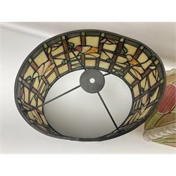 Tiffany style lamp shade, of oval form, with pale peach flowers on a cream and orange lattice ground, together with three other Tiffany style lamp shades and a moulded glass lamp shade with four coloured panels, oval Tiffany style W28.5cm