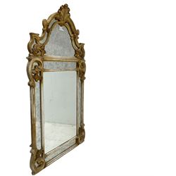 Victorian design parcel gilt wall mirror, shaped cresting with foliate cartouche pediment, decorated with C-scrolls and scrolled foliage, moulded frame with segmented mirror plates