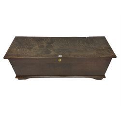 18th century oak sword chest or coffer, hinged lid with moulded edge and iron fittings concealing candle box and main compartment, the front with studwork spelling 'TC 1750', raised on bracket feet