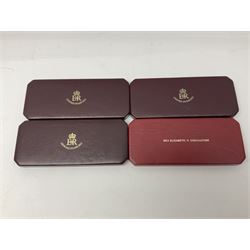 Four Queen Elizabeth II 1953 specimen coin sets, comprising farthing to crown coins, three in maroon Royal Mint dated cases the other in red dated case