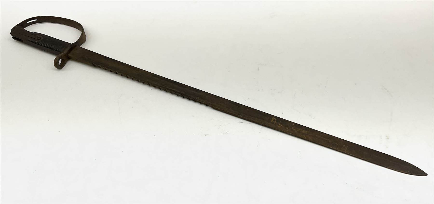 Pattern 1879 Martini Henry Carbine heavy artillery saw-back sword bayonet the 65.5cm fullered blade with various ordnance marks to the ricasso, black chequered grips and D-shaped knuckle guard, lacks scabbard, L79.5cm overall
