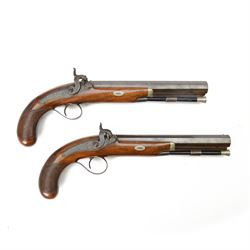 Pair of 19th century officer's duelling pistols, by William Chance & Son, with 25 bore sighted octagonal brown barrels, engraved London to the top, with gilt and platinum lines, foliate engraved tang, the back action lock plate signed and engraved with foliage, the walnut half stock, the trigger guard engraved with foliate and pineapple design, with ebony ramrods, in a brown velvet lined mahogany case, fitted with accessories including a copper pistol flask, a steel bullet mould, a tin of caps, lead balls, a cleaning rod with brass screw top