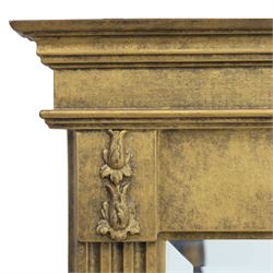 Late 20th century neoclassical style gilt wall mirror, the moulded cornice above a plain frieze centred with foliate mount, fluted pilaster sides with applied ornament, on moulded plinth base surrounding a rectangular mirror plate