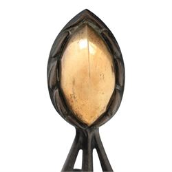 Arts and Crafts cast iron and brass andirons, brass and copper acorn finials above openwork uprights, raised on shaped arched feet with hammered detail
