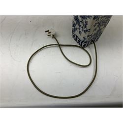 India Jane table lamp, decorated with blue birds and floral vines upon a white ground, fitted with a cream lampshade, H62cm 