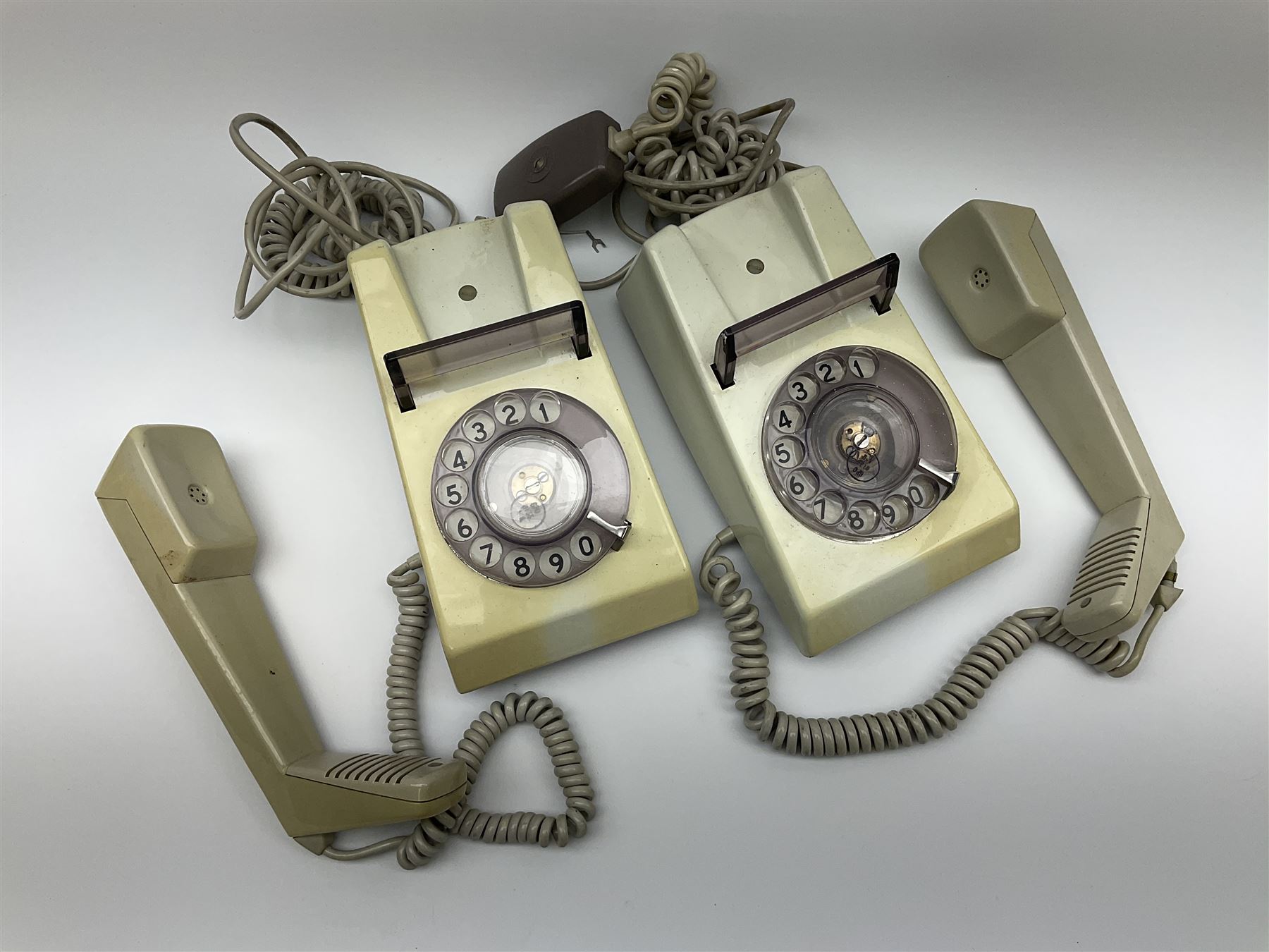 German bakelite morse code key marked 'Entstort' and 'D.R.P. Junker' L15cm; another bearing plaque 'N.S. No.5805-99-580-8558 KEY TELEGRAPH Ser. No. PES597 1973'; and two 1970s turn-dial Trimphones (4)