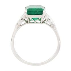 Platinum Colombian emerald and diamond ring, single emerald cut emerald of approx 3.00 carat, each side set with a single baguette cut and heptagonal cut diamond, with The Gem & Pearl Laboratory report