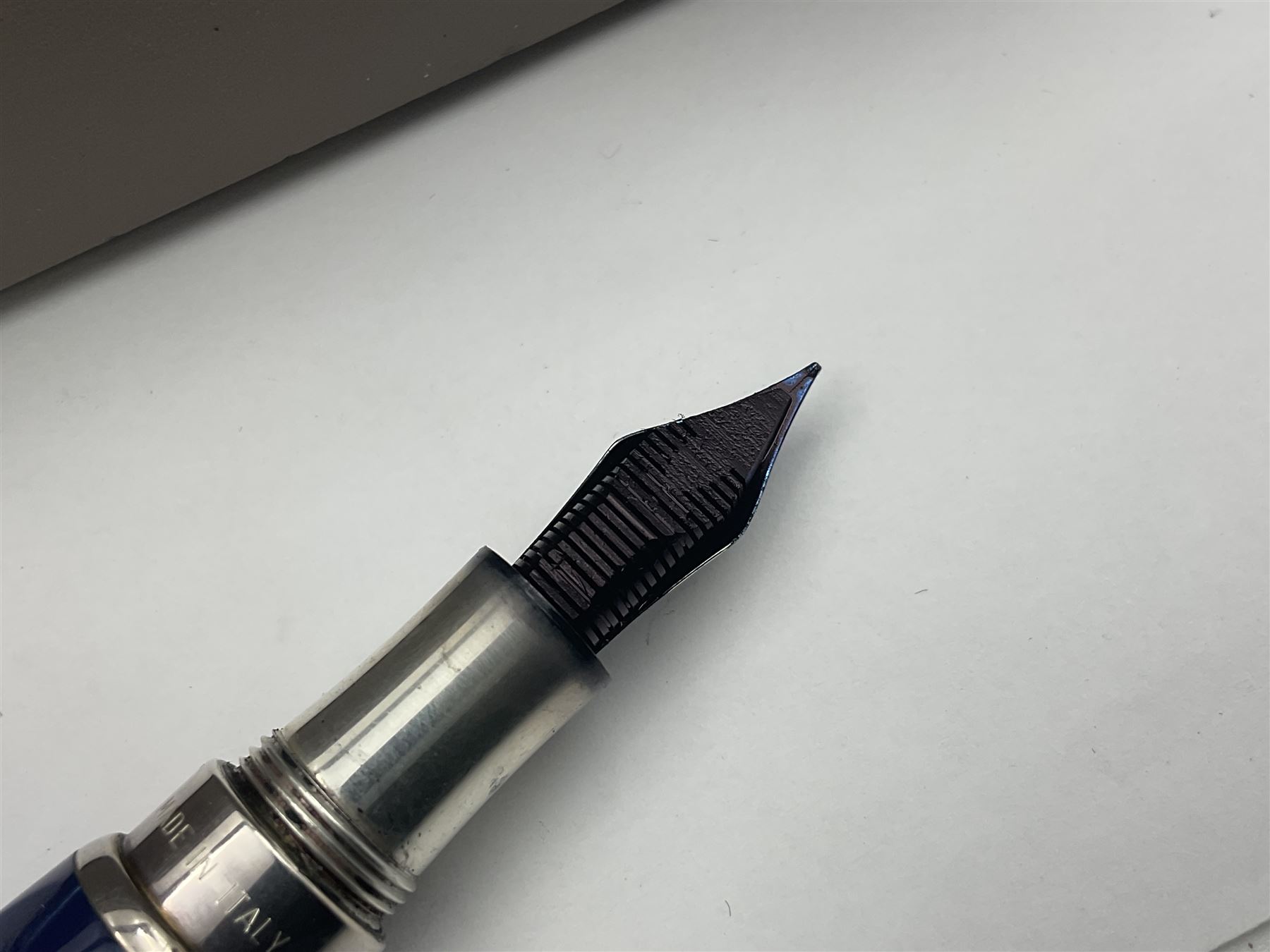 Montegrappa Emblema fountain pen, the blue pearl marbled barrel of octagonal form with silver mounts stamped 925 and silver mounted cap with 1912 emblem and clip with roller, in box, L13.5cm