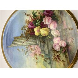 19th century porcelain stand, of circular form, in the Derby style, hand painted with a ruinous column and roses against a landscape background, within a gilt border, D7cm