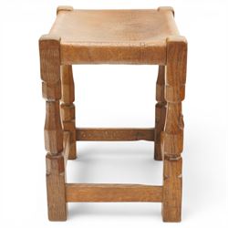 Mouseman - 1950s dark oak dressing table stool, the rectangular top with tan leather seat, raised on octagonal supports united by box stretcher, carved with mouse signature, by the workshop of Robert Thompson of Kilburn