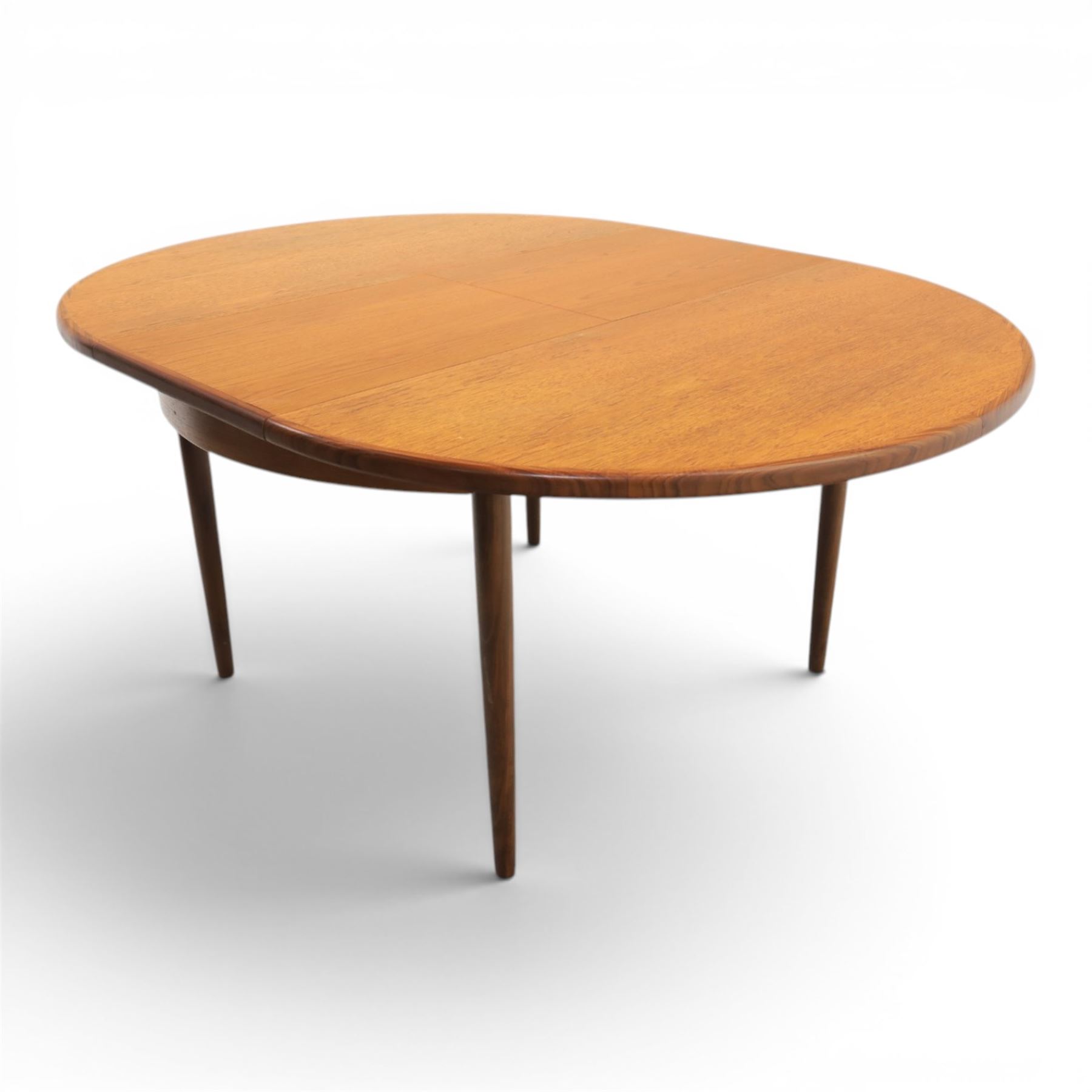 G-Plan - mid-20th century teak 'Fresco' circular extending dining table and six chairs, circular top with storable fold-over leaf extending to 166cm