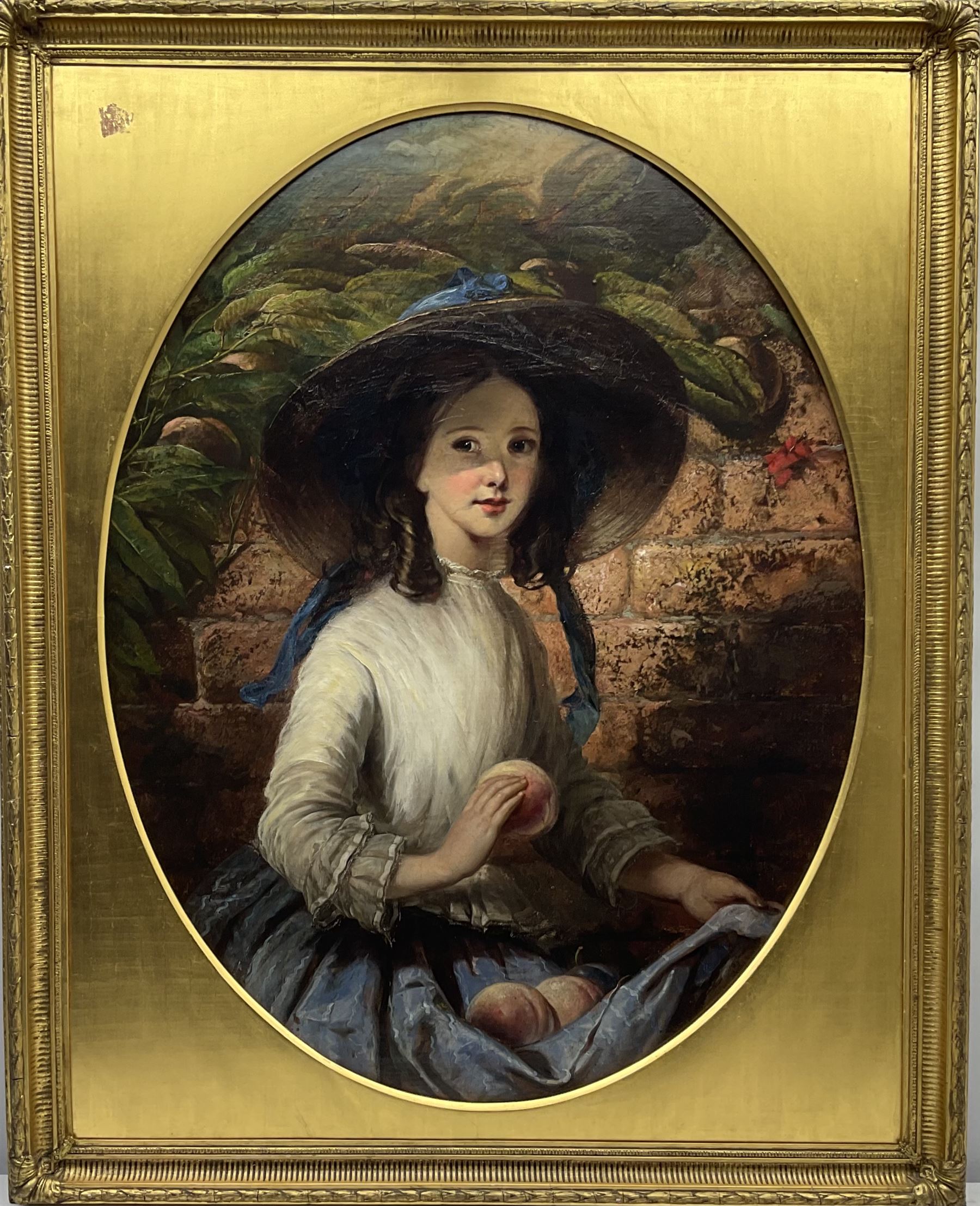 Thomas Musgrove Joy (British 1812-1866): Young Girl with Peaches, oval oil on canvas signed 88cm x 68cm