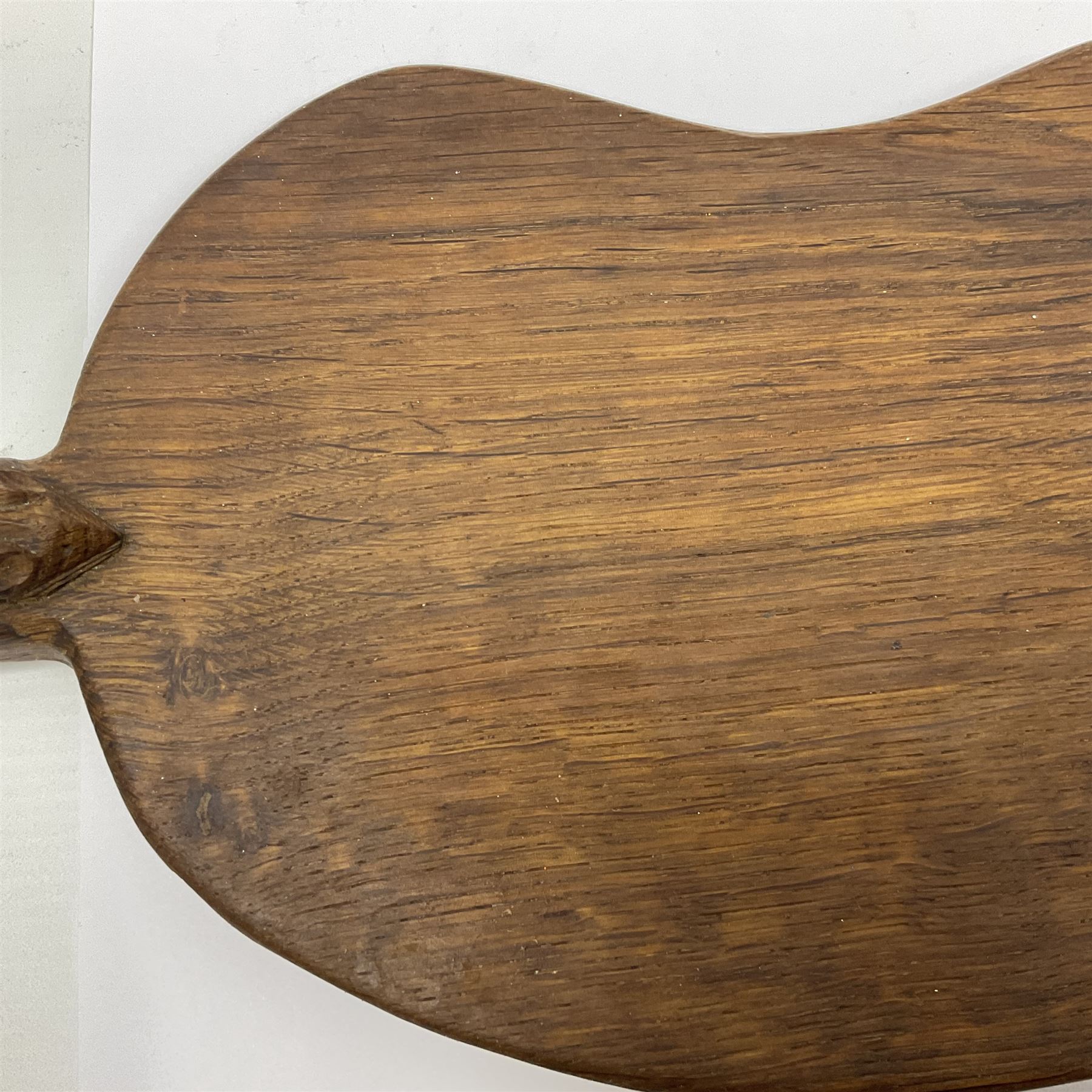 Mouseman - oak kidney-shaped cheeseboard, the handle caved with mouse signature, by the workshop of Robert Thompson, Kilburn 