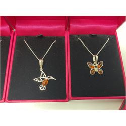 Six silver Baltic amber pendant necklaces, including dinosaur and butterfly designs, all stamped 925 