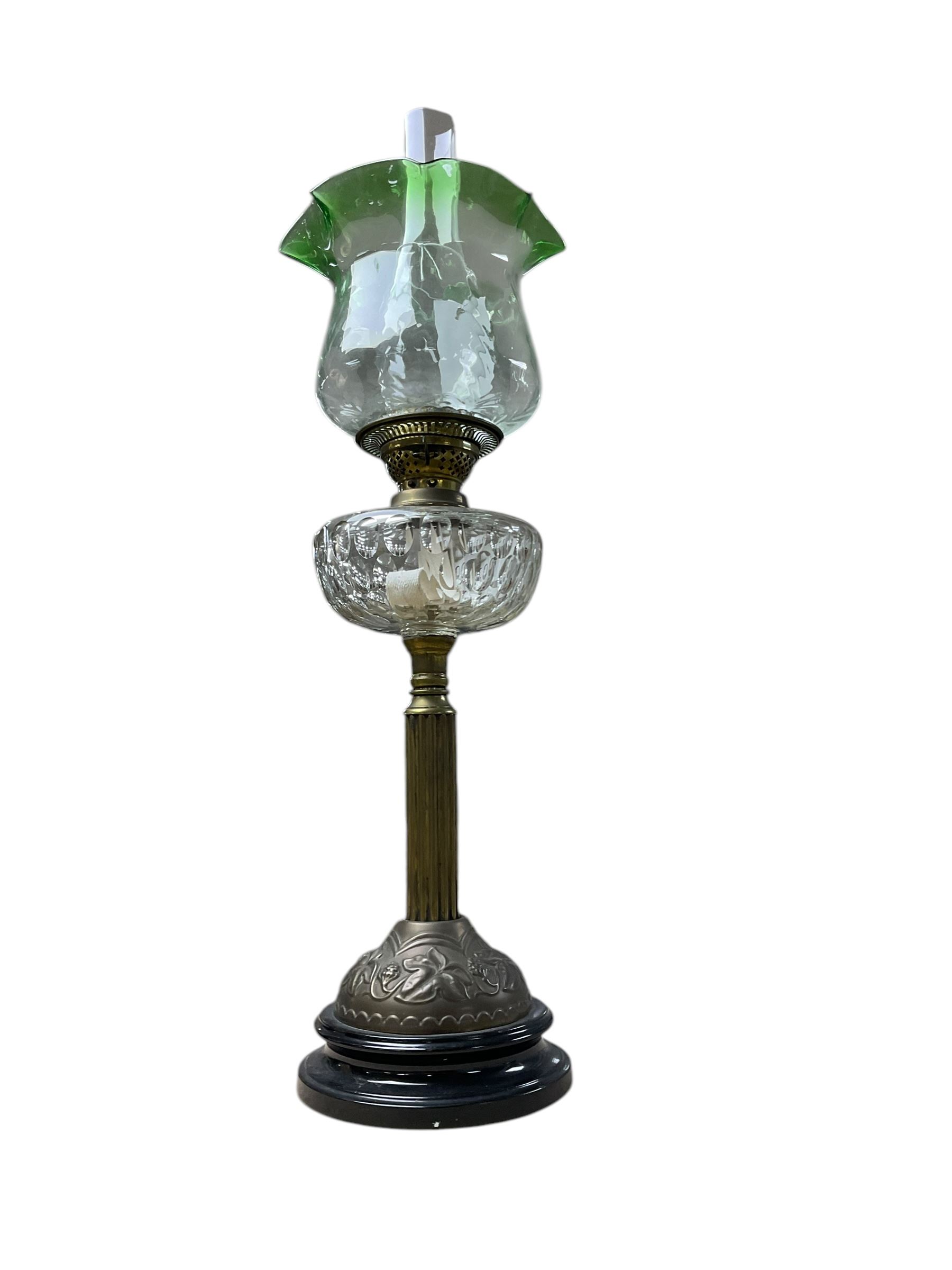 Oil lamp with frilled green glass shade, glass reservoir, upon upon corinthian column with stepped circular base, H74cm