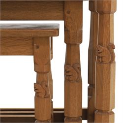 Squirrelman - nest of three tables, each with rectangular top upon octagonal turned supports with squirrel carving, by Wilfrid Hutchinson, Husthwaite