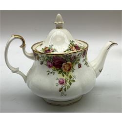 Royal Albert Old Country Roses part dinner and tea service comprising teapot, four tea cups and saucers, eight dessert plates, cake plate, cake stand, a tureen with cover, six dinner plates, an oval dish, two trinket dishes, bell and shoe decoration. 
