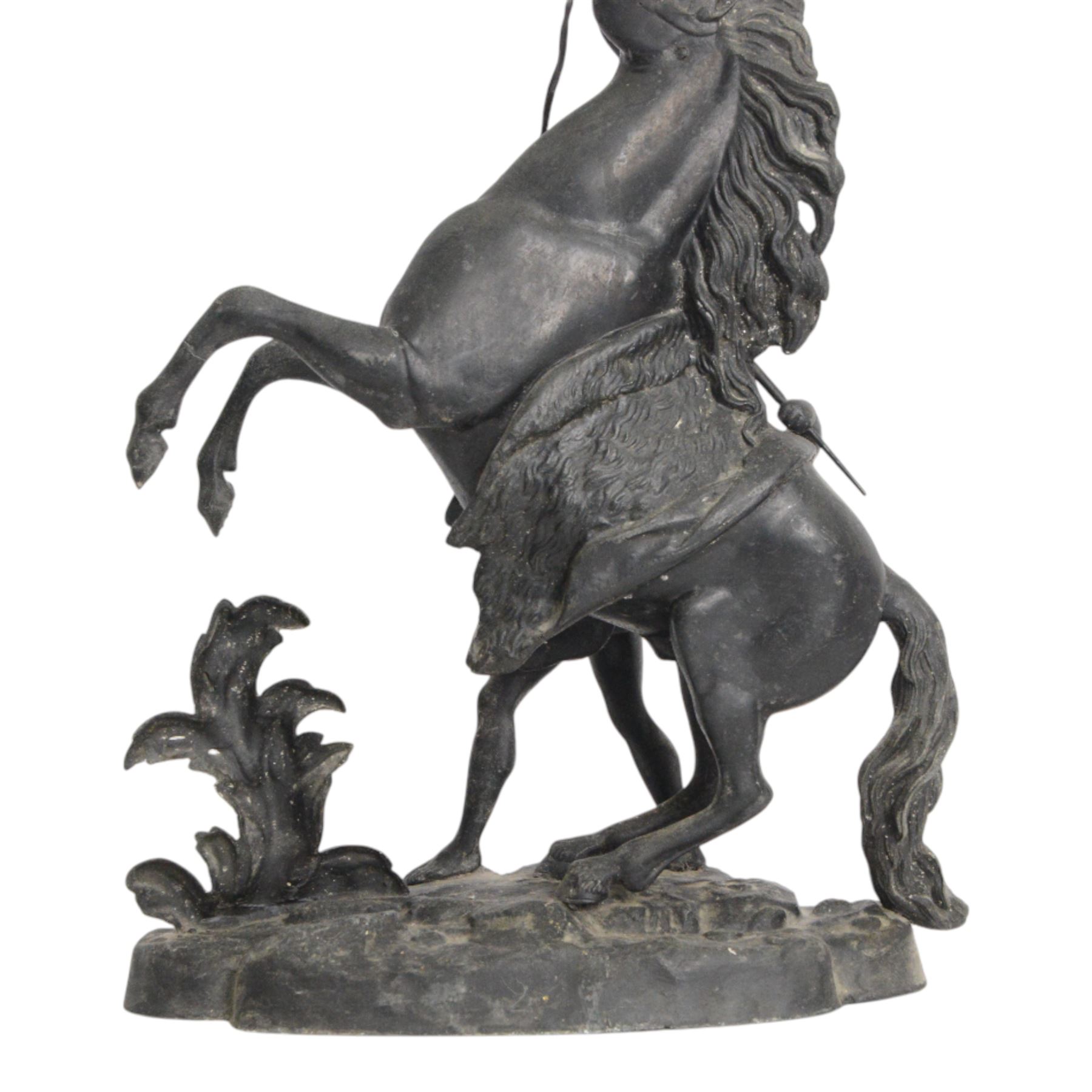 Three spelter Marley Horse figures, after Guillaume Coustou, each modelled as a rearing horse restrained by  groom, tallest H41cm