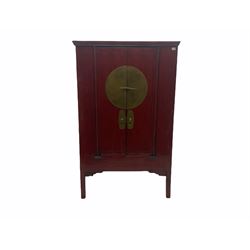  Chinese red lacquered elm and pine Moon marrige cabinet, enclosed by two doors, brass metalwork and hinges