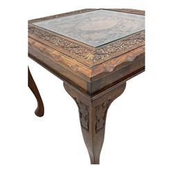 Pair of Pakistan carved hardwood brass inlaid lamp tables, square form, cabriole legs, inset glass tops